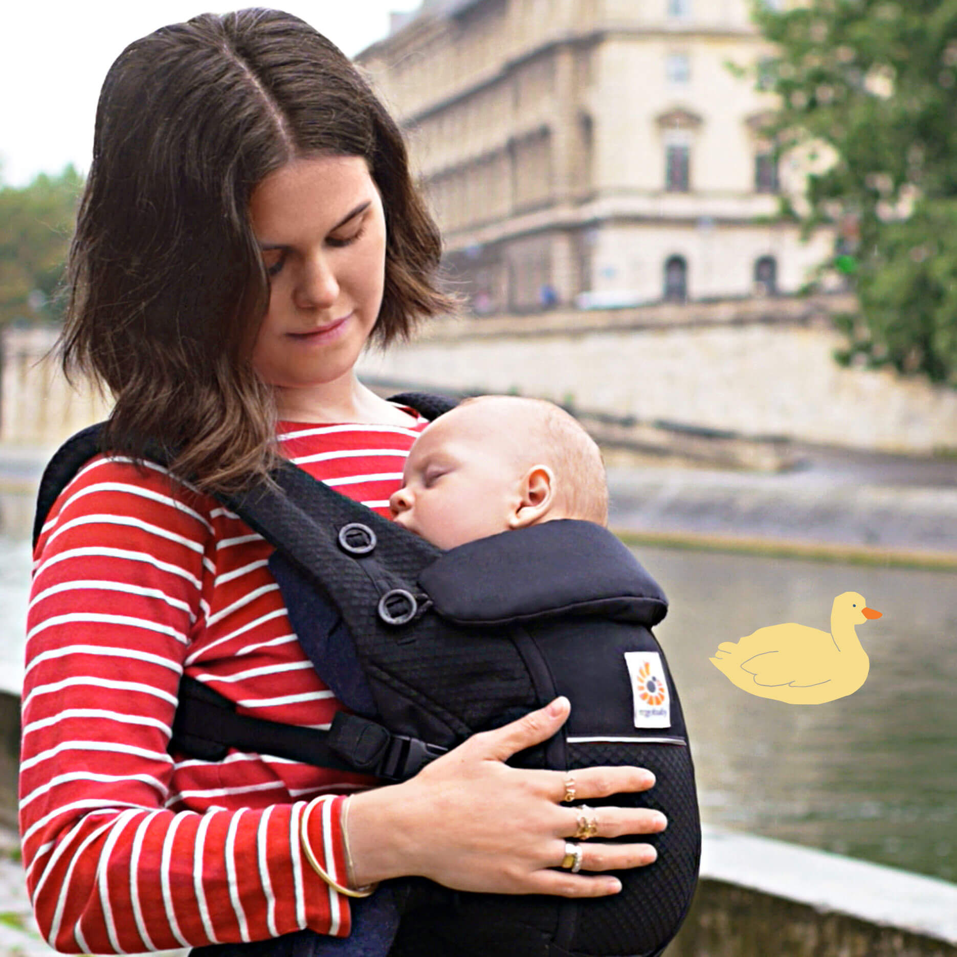 Omni breeze poster photo mother carrying child in baby carrier Omni breeze