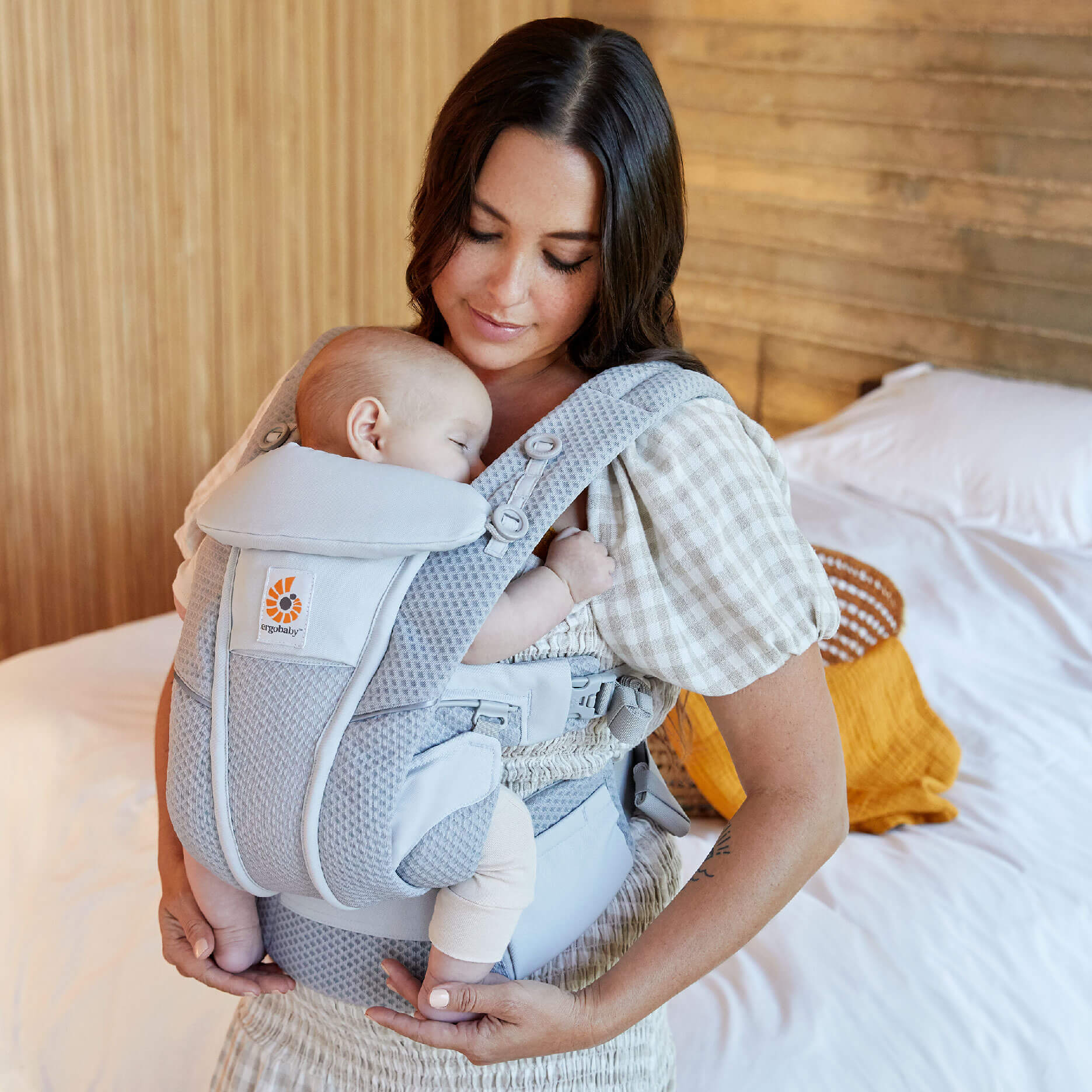 Omni breeze poster photo mother carrying child in baby carrier Omni breeze