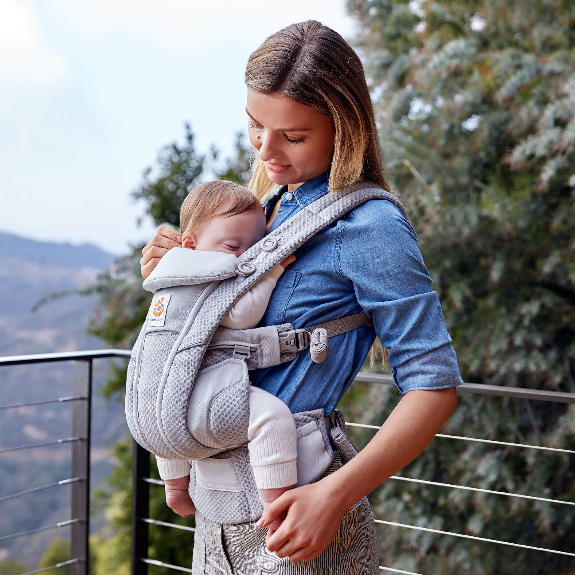 Omni Breeze poster photo mother carrying child in baby carrier Omni Breeze